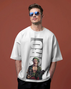 Man wearing a white t-shirt with a graphic design on a brown background